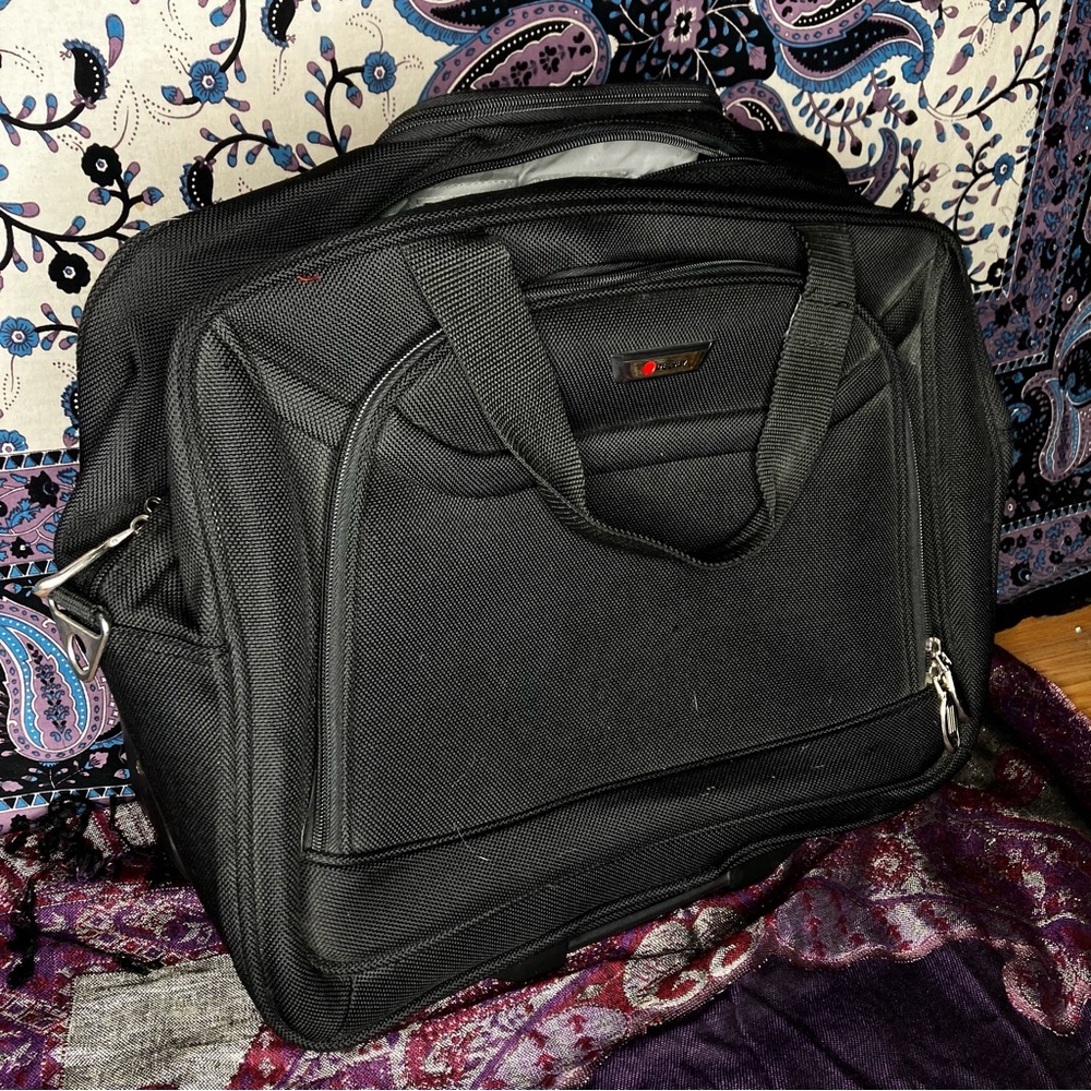 Delsey rolling carry on luggage bag